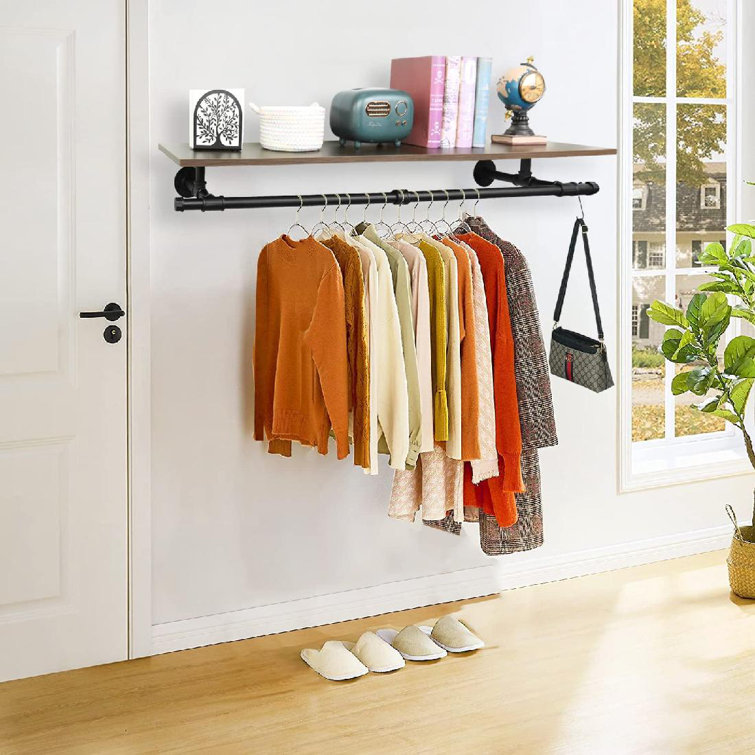 Hanging wall clothes discount rack